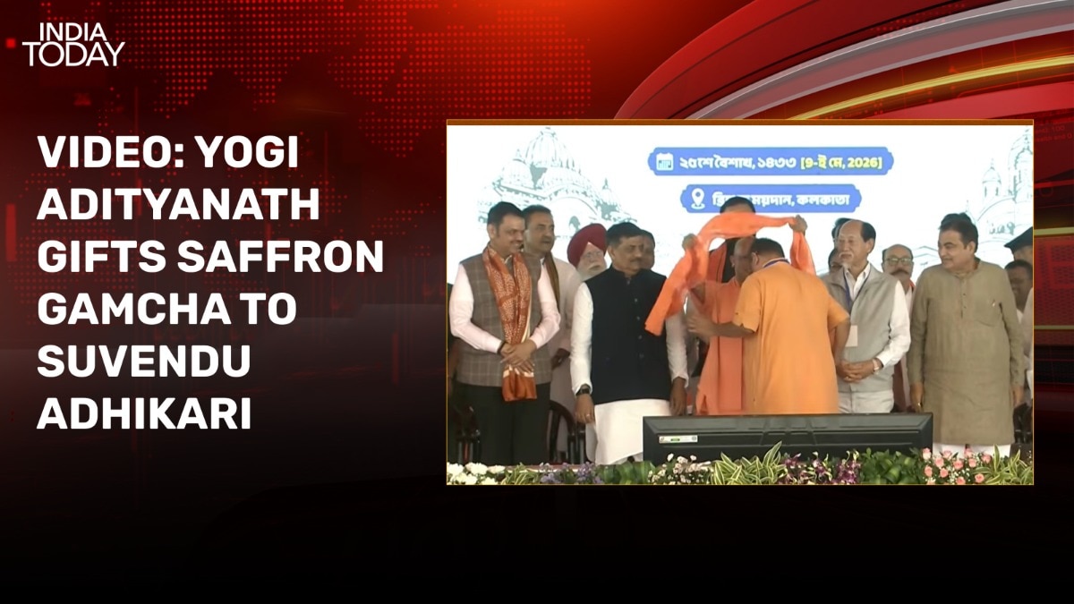video: yogi adityanath gifts saffron gamcha to suvendu adhikari at